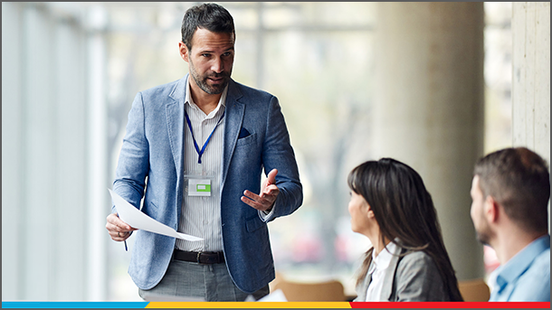 Businessman presenting to two other business professionals